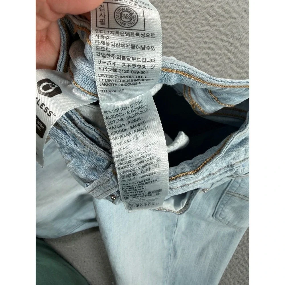 Levi's 725 High Rise Bootcut Jeans Womens 30 (26x32) Light Wash Raw Hem